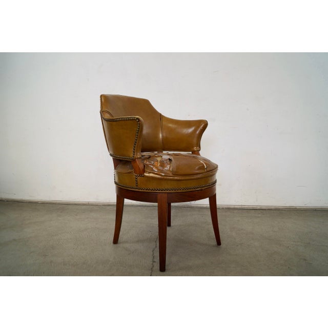 Vintage original Mid century Modern leather arm chair for sale. This is a rare chair that was manufactured by Barnard &...