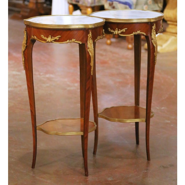 Add a touch of French elegance to a living room, bedroom, or study with this refined pair of side tables. Crafted in...