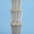 A vintage floor lamp in the style of Serge Roche, its carved sculptural stem bringing French 1940s artistry to reading...