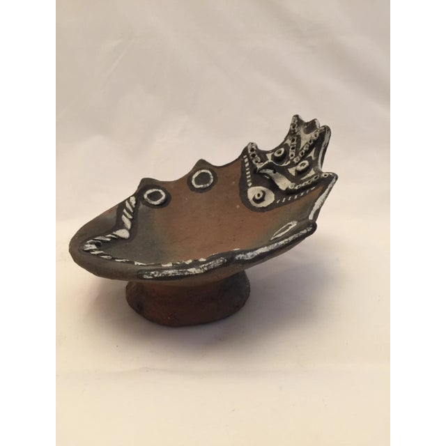 This dish comes from the Sepik people of Papua New Guinea. The distinct design and clay comes from only one place on...