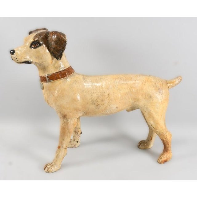 An exceptional, antique dog figure in the style of the famous trademark "Nipper" (His Master's Voice / RCA Victor). In...