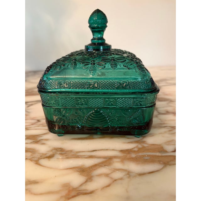 Spruce colored bee box made by Indiana Glass Tiara exclusive with finial, peg feet and embossed bee design throughout. In...
