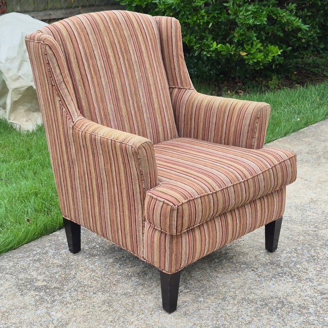 This is a large-scale transitional style wingback chair made in the United States by Stratford, a division of Caye...