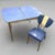Genuine 1950s Formica dinette set with classic atomic-era style. This set includes a blue cracked ice Formica table with...