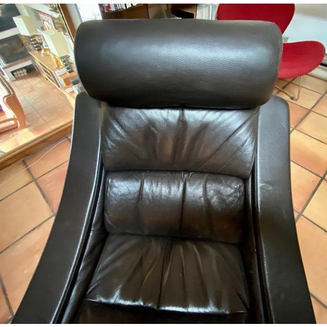 "pair of armchairs and their ottomans by ake fribytter for nelo sweden 1970" pair of ake fribytter chocolate leather chair...