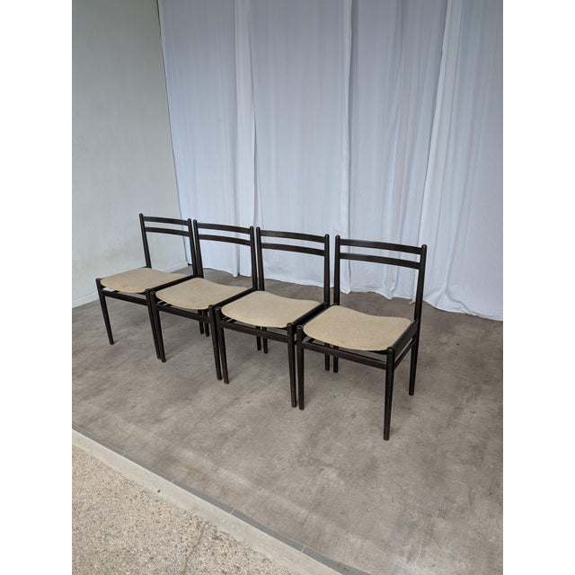 Set of four vintage dining chairs by Stol Kamnik, produced in Yugoslavia in the 1970s. The chairs feature a clean, minimal...