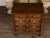 An English George III period oak geometric front chest from the early 19th century, with five drawers, brass Chippendale...