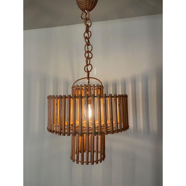Bamboo Pendant Light, 1950s, in Very Good conditions. Designed 1950 to 1959 Up to 250V (Europe/UK Standard).The wiring of...