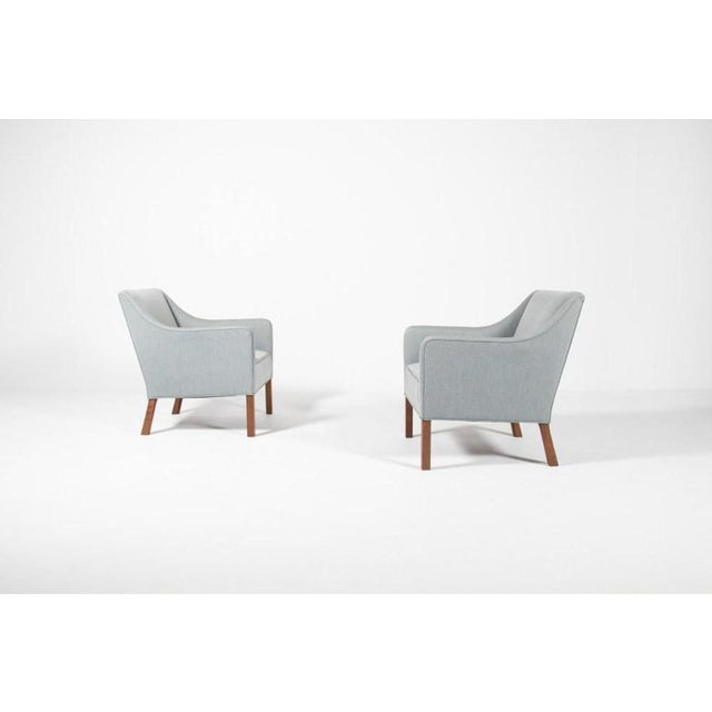 Set of two Modern Einar Larsen easy chairs in wool fabric on stained wood legs produced in 1950s. Condition Very good, few...
