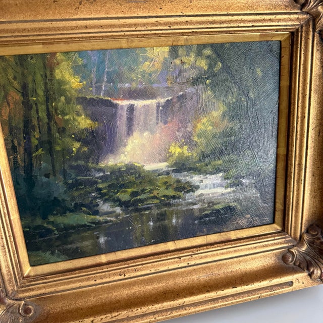 This oil on panel of a waterfall and woodland landscape was painted on location in Mill Creek Park, Ohio. Signed by the...