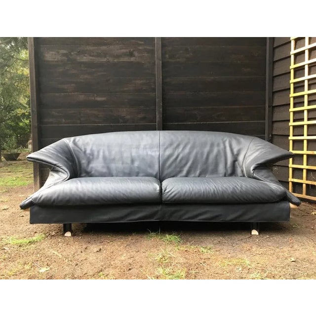 Striking anthracite / Dark Blue / Grey Leather sofa manufactured by Saporiti circa1980s. Its design is definitely inspired...