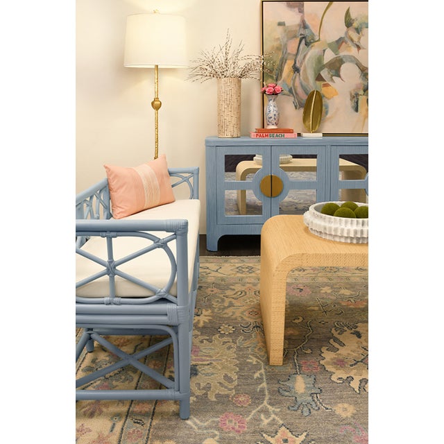 Sit pretty on our Ferguson Light Blue Rattan Bench! Made of durable, light blue rattan, this decorative bench comes with a...