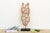Figures like these don't stand alone, they hold each other up, literally. Carved from a single length of wood, this...