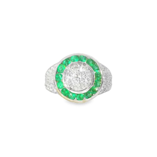 18K white gold Art Deco ring featuring 0.75 carats of emeralds and 1.05 carats of brilliant round diamonds. Size 6.5,...