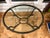 Gorgeous 1980s French wrought iron oval coffee table with beveled glass top. Features a hand forged iron base with classic...