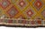 This is a vintage Turkish Oushak rug from the Mid 20th Century. The piece was hand-knotted.