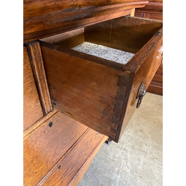 Antique oak dresser with mirror. Two over two dresser drawers, paneled sides with scroll cut aprons. Think serpentine top...