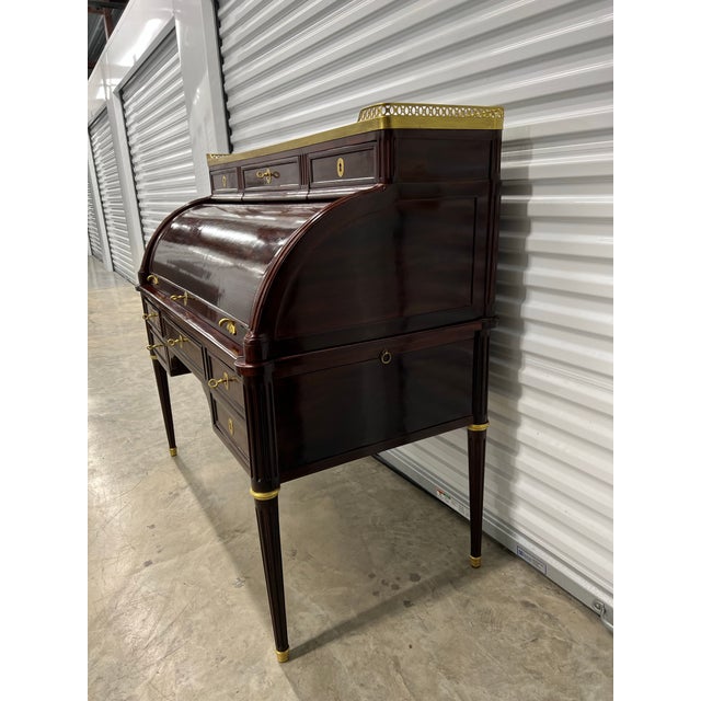 18 c.Cylinder Desk from the Louis XVI period in mahogany and mahogany veneer on oak frame.It opens with three tiered...