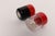 Vintage Postmodern Guzzini pepper and salt set (ca. 1970s, Italy). Pepper mill is black and red acrylic, and salt is...