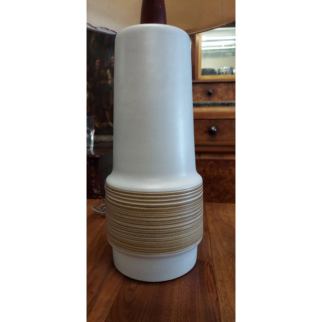 The ceramic lamp is in fine condition. The shade has a waterstain and is separating. BE sure to look at all of the photos....