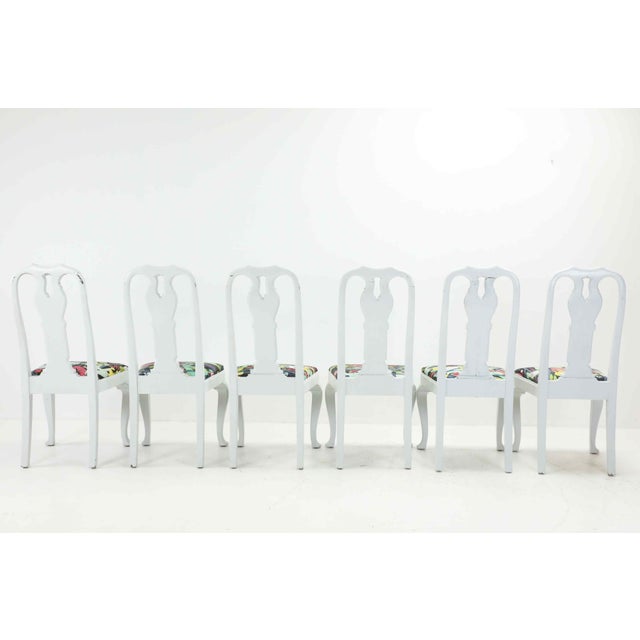 A charming set of six Swedish Rococo-style dining chairs, featuring delicately curved frames and a classic painted finish....