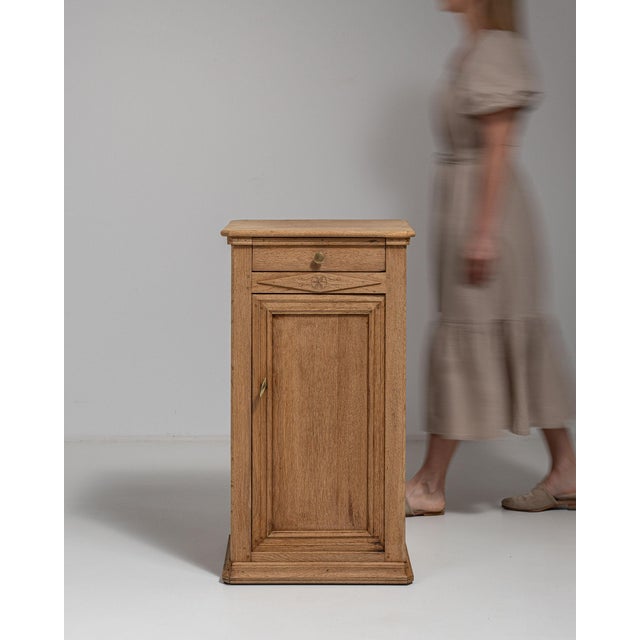 This 19th century side table from France is finished in amber, worked in oak. Its form follows honest, well-proportioned...