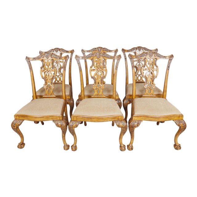 A set of six hand carved Chippendale style dining side chairs by Maitland-Smith. Fiddle shaped pierced splat backs are...