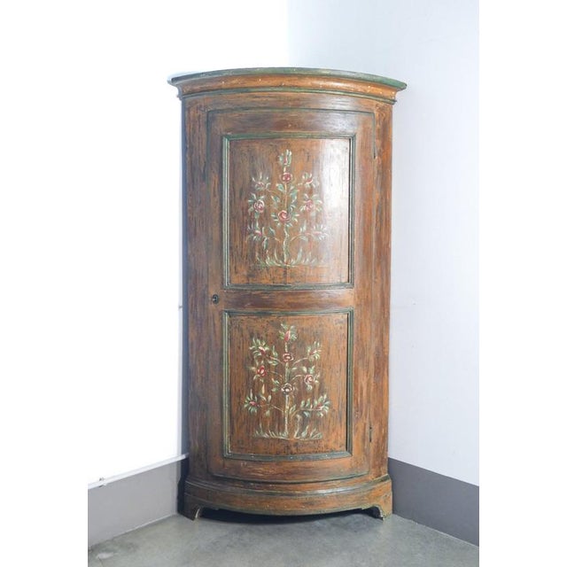 Antique hand-decorated solid wood corner cabinet with a single door. Italy, 19th century. Origin: italy. Period: 19th...