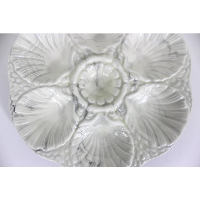 Vintage handmade ceramic oyster plate with marbled white and black glaze. Holds six oysters plus a centre cup. No damage....