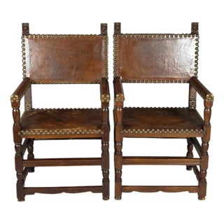 Early 20th Century Pair of Addison Mizner Antique Spanish Colonial Revival Oak Armchairs With Carved Figural Busts & Leather Upholstery For Sale
