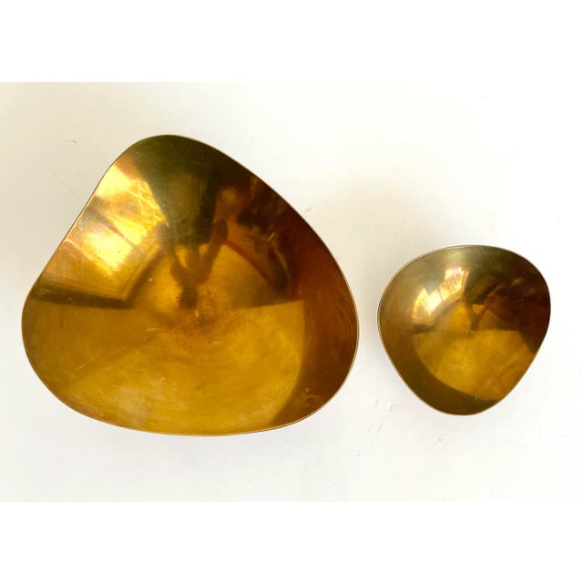 Here is a beautiful pair of brass bowls made by Raymor in the mid-century. They have an amazing, organic, retro shape with...