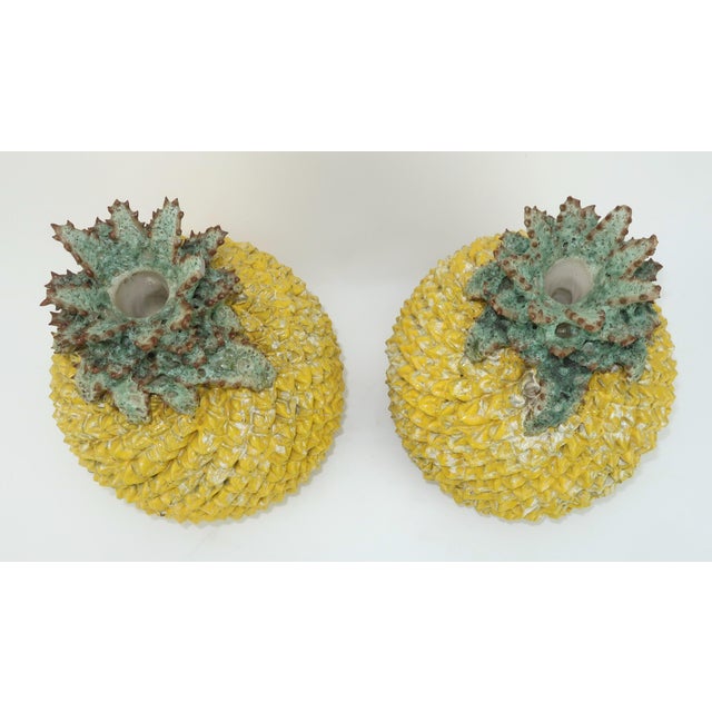 Add a little tropical fun to your decor with a pair of Currey & Company pineapple pottery boxes. The pottery style has a...