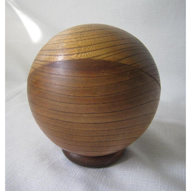 Fabulous Mid Century wood pen/pencil holder. Globe shaped and hand carved. It measures 5"H x 5"D and is in excellent...