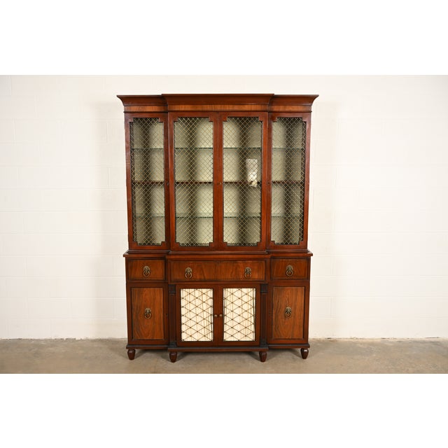 A beautiful English Regency or Georgian style breakfront bookcase or dining cabinet By Kittinger USA, Circa 1960s Carved...