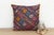 This 16-inch square pillow is a breathtaking fragment of Rajasthani heritage, repurposed from antique Banjara textiles...