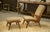 A Scandinavian lounge chair from the 1960s, with low, sloping lines, designed for relaxing. It features a wooden frame...