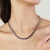 This elegant tennis necklace is crafted in 925 sterling silver and beautifully set with 65 natural deep purple amethyst...