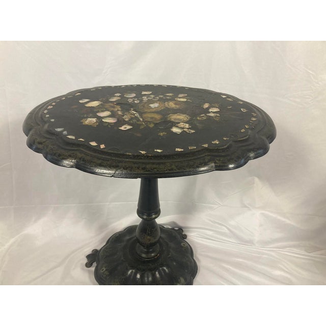 A truly spectacular piece of Victorian decorative art — a genuine 19th-century papier-mâché pedestal table featuring...