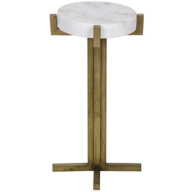 Cool marble plays with warm antique-brass finished metal in this slim and sleek side table.