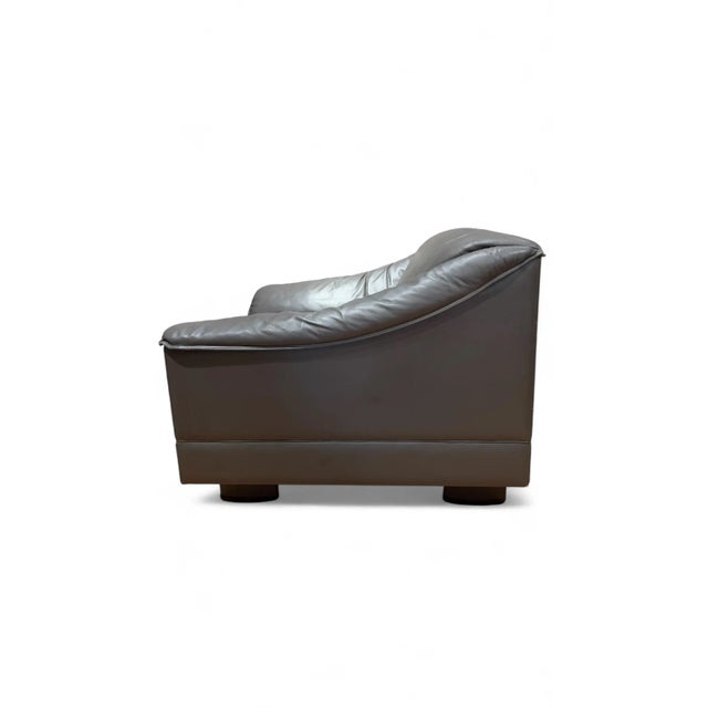 Rare Poltrona Frau leather ‘Serena’ lounge chair, designed by Tito Agnoli. Made between 1980 and 1989. The chair showcases...