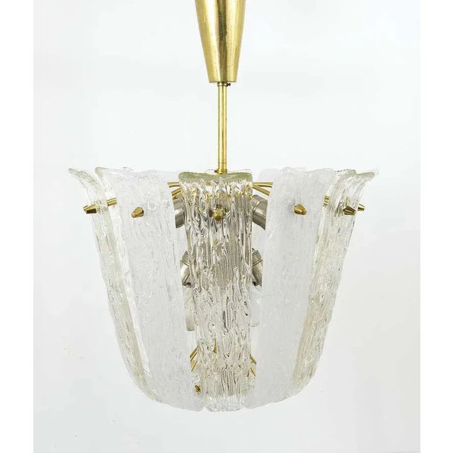 A beautiful Viennese Mid-Century brass chandelier by Kalmar Vienna from the 1950s. Has lovely curved clear and frosted...