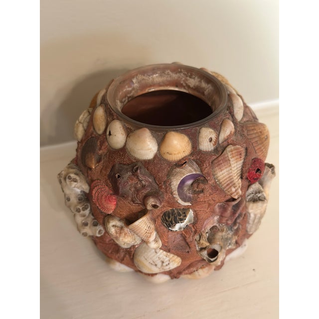 Vintage Shell-Encrusted Coastal jar A charming vintage shell-encrusted candle holder featuring an artfully arranged...