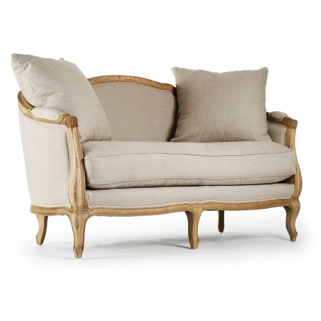 Curved back settee upholstered in natural linen on natural oak frame.