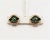 This is part of Chairish’s Costume Jewelry assortment. 1950s round goldtone triangular shaped faux-emerald butterfly clip...