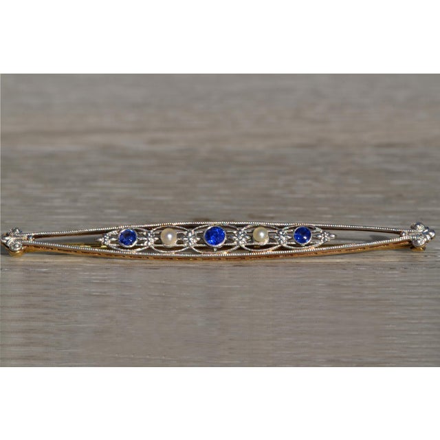 The Bazan Bay: Ladies Antique 14K and Platinum Bar Brooch set with Sapphires and Pearls. Introducing our stunning antique...