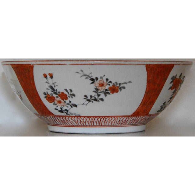 Bountiful orange tone flowers will make this a colorful addition to your Oriental collection. A hand-painted border...