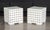 Pair of Skyline Design Glass Top Side Tables, on woven white plastic bases. 25" H x 24.5" W x 24.5" D. Provenance: From a...