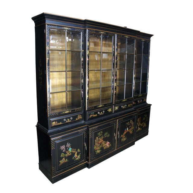 Vintage Union National breakfront china cabinet featuring black lacquer with four hand painted Chinoiserie scenes. One...