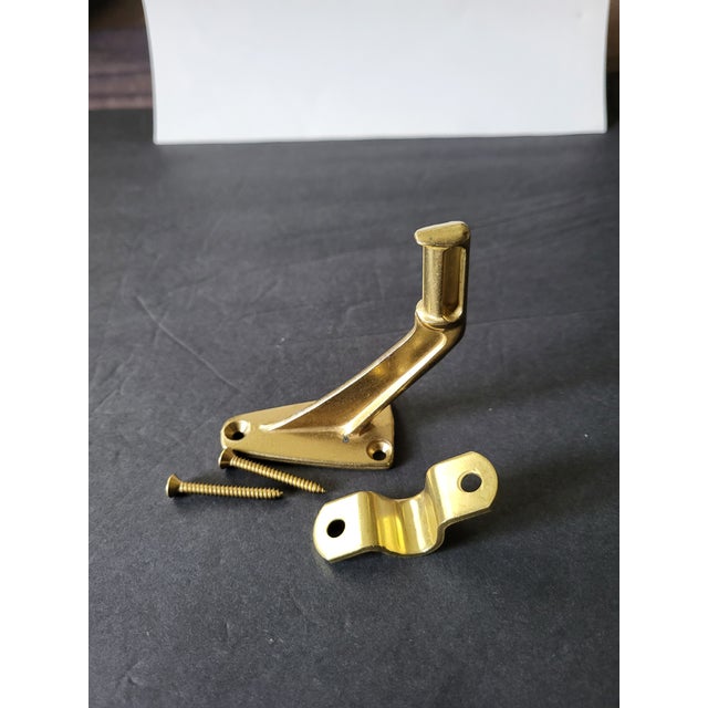 Solid brass kickdown door stopper, new open package. Never been used. hardware included.