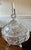 This is a beautiful, footed lead crystal candy dish, featuring a distinct lid topped with a tall obelisk-shaped finial....